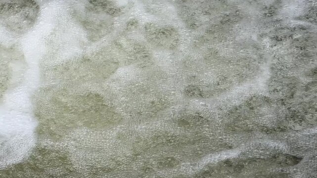 Slow motion of rushing water fresh and clean in a river in England UK 4K