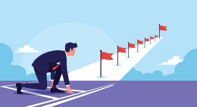 Determined businessman in a starting position on a track looking towards a path lined with red flags represents the start of a business journey.
