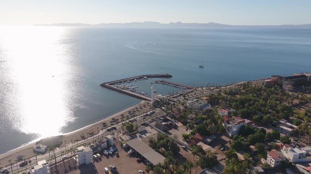 See the stunning sunrise views above the waterfront and malecon in Loreto Baja California Sur Mexico while enjoying this memorable moment.