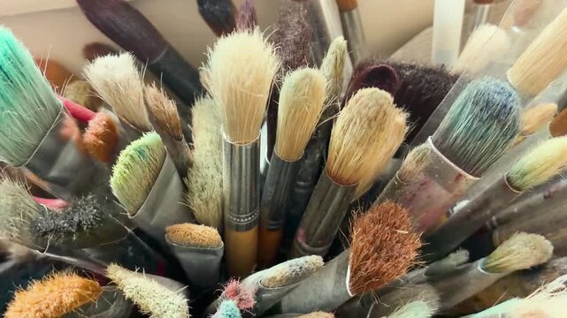 Close up of a collection of different artistic paint brushes in a studio, Artist, Painting, Atelier
