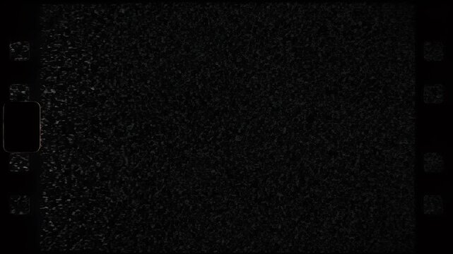 A dark, abstract background resembling film grain or static.