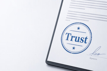 Fototapeta premium Digital document shows a blue trust stamp and signature. Space for text.