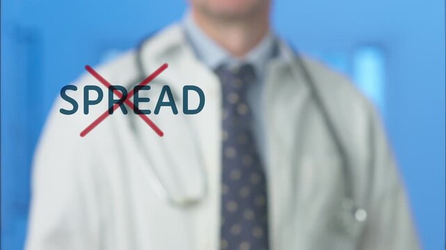 Medical professional crossing out the word 'spread' on a glass screen, symbolizing the fight against the ebola virus epidemic and the importance of prevention and containment measures