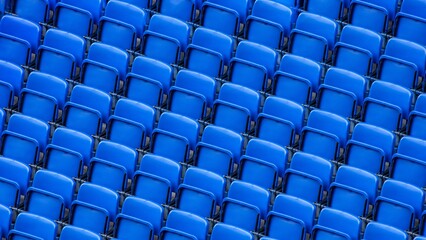 Obraz premium Seamless pattern of empty bright blue plastic seats in a modern sports stadium