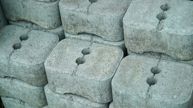 Precast concrete building blocks with anchor holes stacked together
