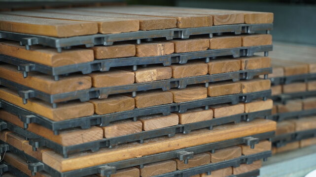 Stacked interlocking wooden deck tiles