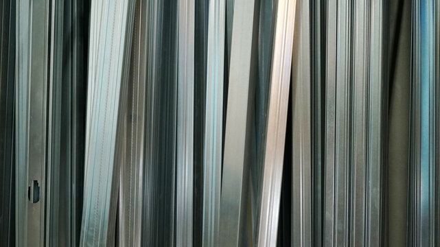 Abstract linear pattern of galvanized steel studs and tracks