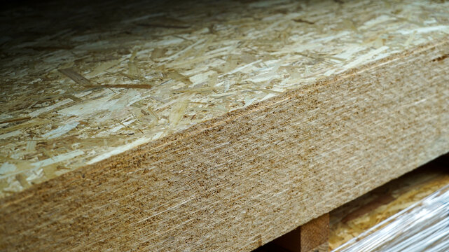 Angled view of stacked oriented strand boards OSB on a pallet