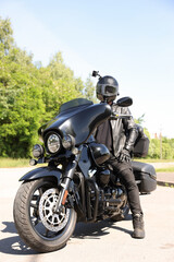 Fototapeta premium Man in helmet on modern motorcycle outdoors