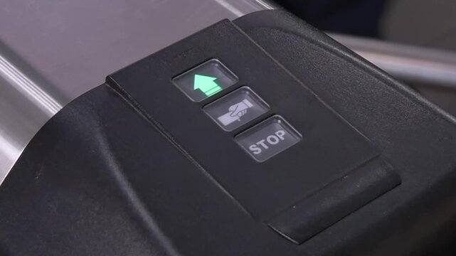 Hand holds smart card close to access control panel. Panel shows different lights as card is scanned, indicating whether access is granted or denied. This process ensures security and efficiency.