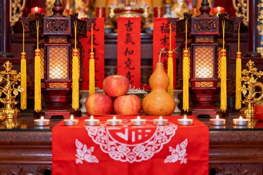Chinese Traditional Altar Setup with Lanterns and Fruit