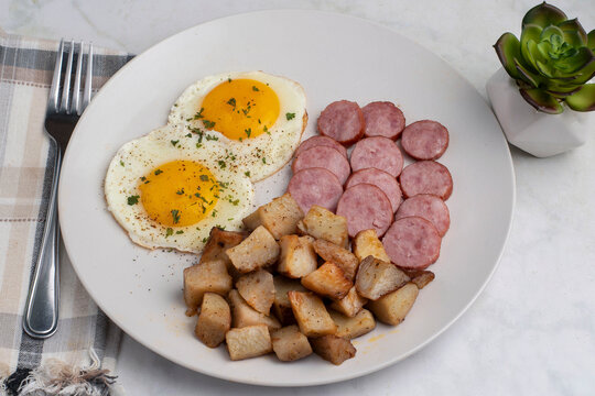 fried eggs with  home fries and kielbasa