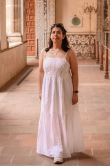 Obraz premium Portrait of a Woman in White Dress Inside Malinalco Convent Corridor
