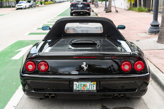 Miami, Florida, USA - July 27, 2025: Ferrari F355 Spider 1996 convertible car. Convertible car Ferrari F355 Spider. Car Ferrari F355 Spider parked outdoor. Black convertible, corner view