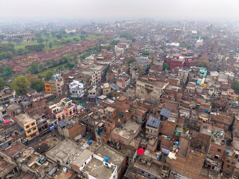 Aerial view of the Walled City of Lahore with its dense historic rooftops, narrow streets, and traditional brick architecture in Lahore, Punjab, Pakistan.