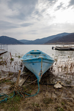 Blue Fishing Boat on a Quiet Mountain Lake