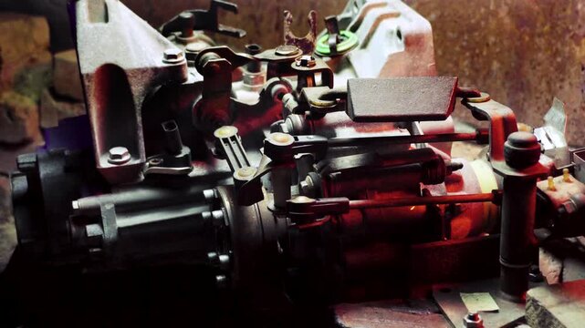 old gear shift box for front-wheel drive car cleaning from dirt with chemical agent and rinsing with water