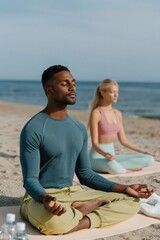Fototapeta premium Man and woman meditating together on coastal sandy beach session