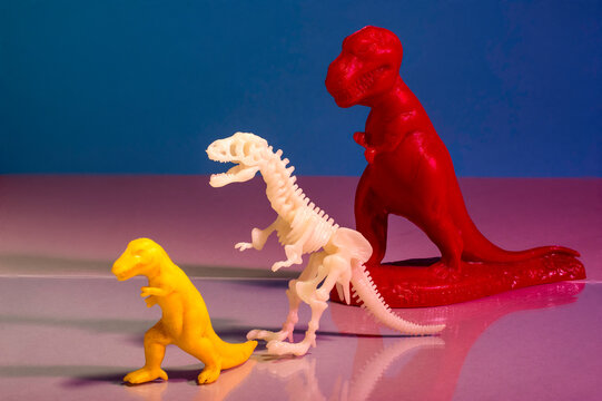 Vintage and Museum Toy Tyrannosaurus Rex Figures on White Background &mdash; Dinosaur Collection Studio Photography