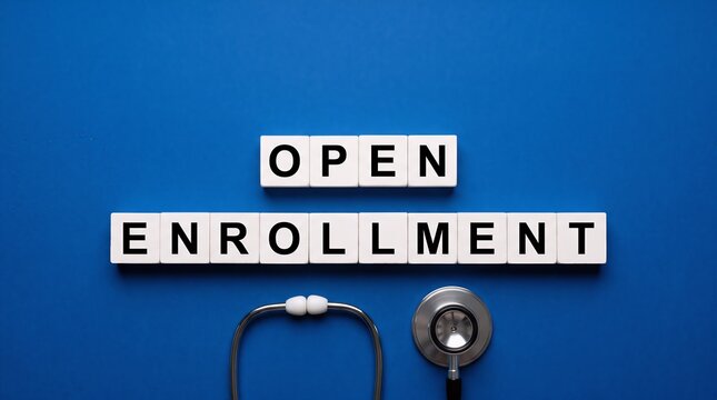 Open enrollment text tiles arranged neatly above a professional medical stethoscope on a flat blue backdrop symbolizing healthcare registration with sign up, enrollment