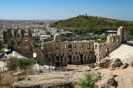 Stone amphitheatre ruins of the Odeon of Herodes Atticus on the slope of Athens Acropolis