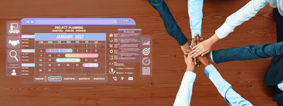 Collaborative Team Meeting for Project Planning with Digital Interface Calendar and Hands Joined Together on Wooden Table Fluxor.