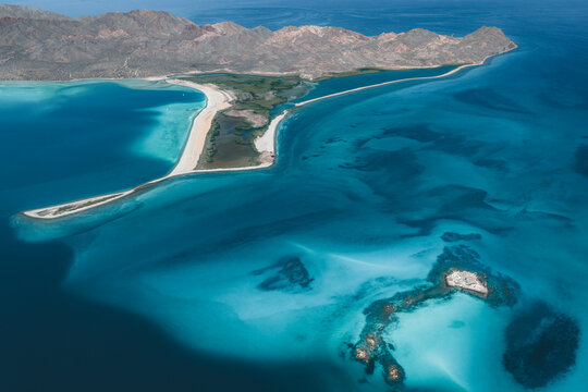 Aerial view of the turquoise waters and sandy spit of Isla San Jose, Baja California Sur, Mexico.