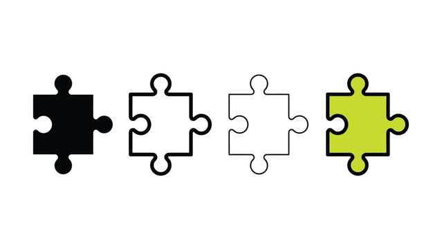 Four puzzle pieces in different colors on white background