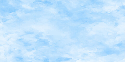 Soft, ethereal clouds drift across a serene, pale blue sky, evoking a sense of peace and tranquility. © jaduuu