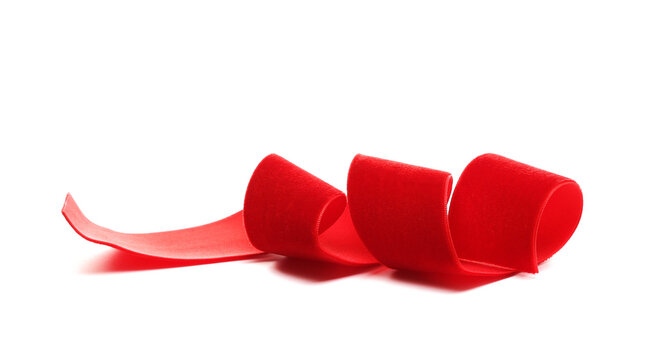 Red soft, plush, velvet ribbon isolated on white background, side view
