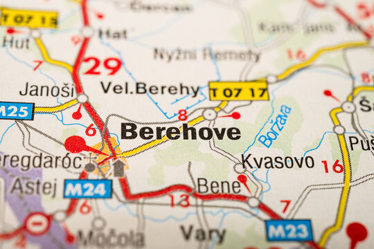 Macro photograph of printed road map highlighting Berehove and nearby towns in Ukraine.