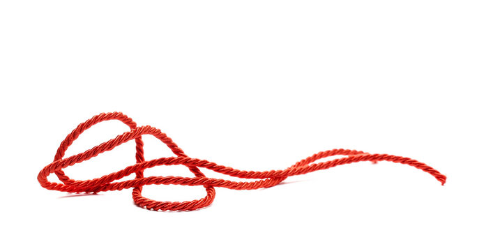 Red string, rope isolated on white background, side view, design element
