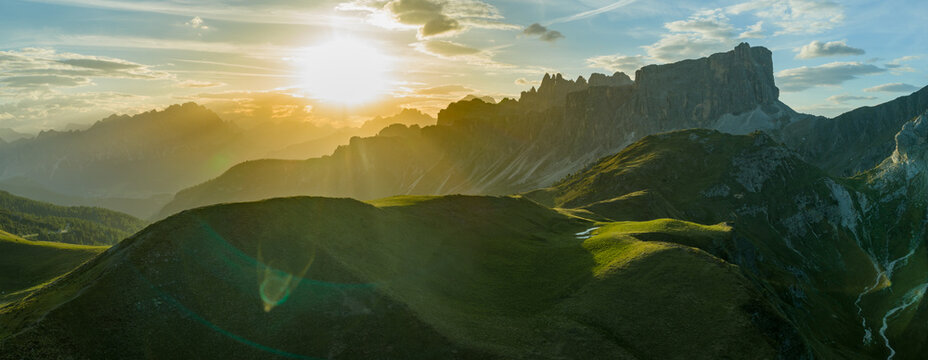 Panoramic Sunset over Dolomite Mountain Peaks in Summer