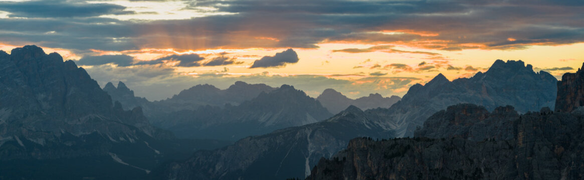 Panoramic Sunset over Dolomite Mountain Peaks in Summer