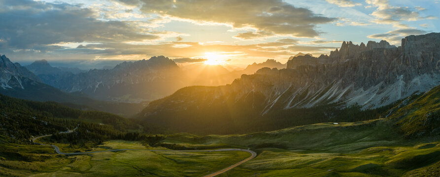 Panoramic Sunset over Dolomite Mountain Peaks in Summer