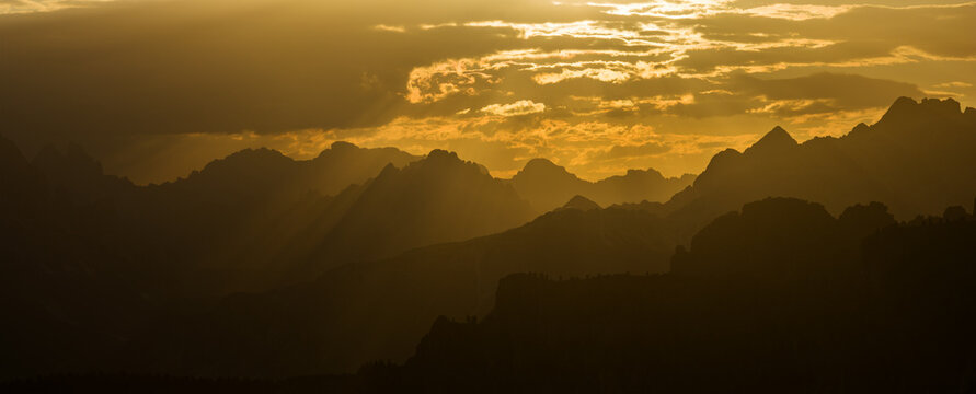 Panoramic Sunset over Dolomite Mountain Peaks in Summer