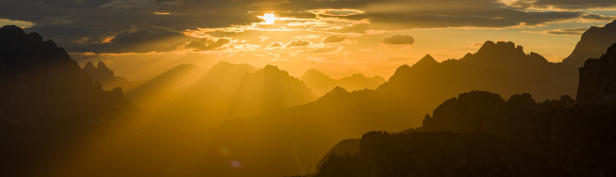 Panoramic Sunset over Dolomite Mountain Peaks in Summer