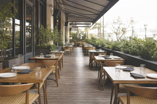 Wide Outdoor Restaurant Table Rows With Soft Faded Daylight With Layered Restaurant Depth And Contemporary Cafe Dining