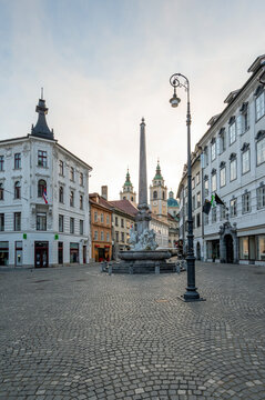 Robba Fountain - Robbov Vodnjak - in Town Square in central Ljubljana, Slovenia in early morning summer light with Ljubljana Cathedral in background.