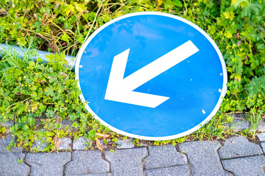 Fallen traffic sign, poor decisions urban planning and personal choices, failed guidance, miscommunication, wrong turn in life, career change, being off track from goals, course correction, new path