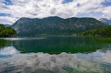 Fototapeta premium Lake Bohinj in Triglav National Park, Slovenia's largest lake under dramatic summer afternoon cloudscape.