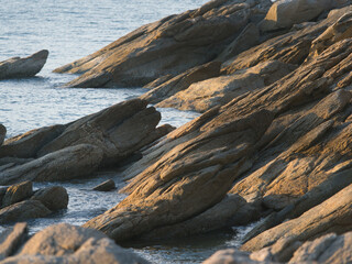 Fototapeta premium Rocky coastline, with its weathered rock formations and seawater backdrop shares characteristics with other coastal beach areas featuring distinct rock formations a tourist attraction in khanom dist 