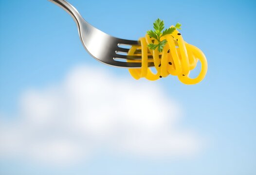 A fork lifting vibrant yellow pasta, adorned with a fresh green herb, against a beautiful blue sky, represents a light, fresh, and delightful culinary experience