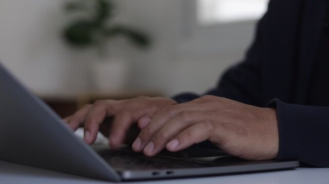 Software developer or programmer writing code on a laptop keyboard. A person working on a programming project with AI technology, focusing on creating innovative software solutions. 