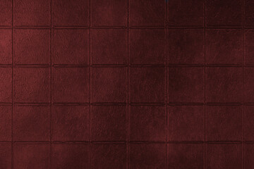 Fototapeta premium Dark red ceramic tile texture background with square pattern and subtle grunge surface. Abstract geometric wall backdrop with textured tiles and copy space. Interior element, vintage design