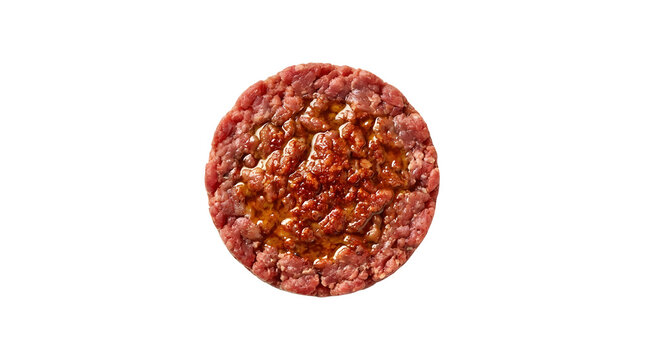 Premium presentation of Ethiopian kitfo made of finely minced raw beef seasoned with aromatic mitmita spice and clarified butter, shaped into a perfect circle on a white background