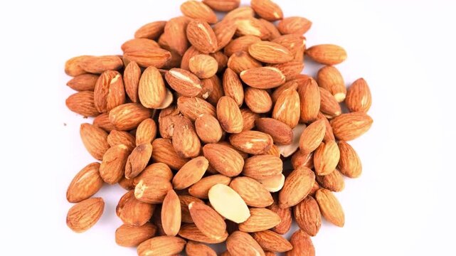 Heap of Raw Shelled Almonds on White Background