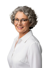Obraz premium Mature caucasian woman with curly grey hair wearing glasses and a white shirt smiling warmly in a studio on a gray background concept of professional wisdom