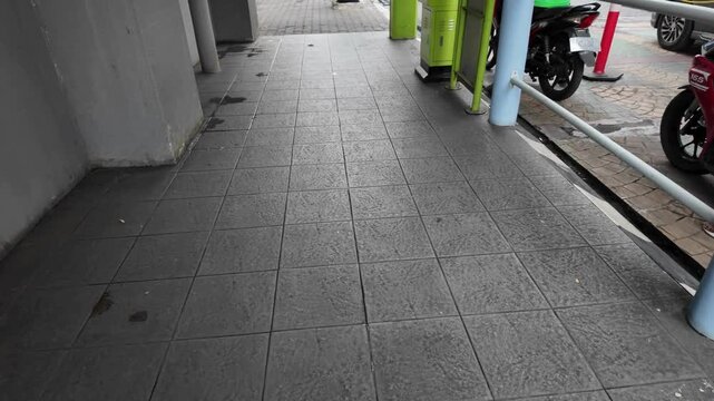 two different types of outdoor paving on a sidewalk or walkway.