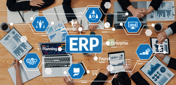 A dynamic business meeting focused on ERP solutions, showcasing teamwork and advanced technology through charts, graphs, and various digital tools in a modern office setting. Amity